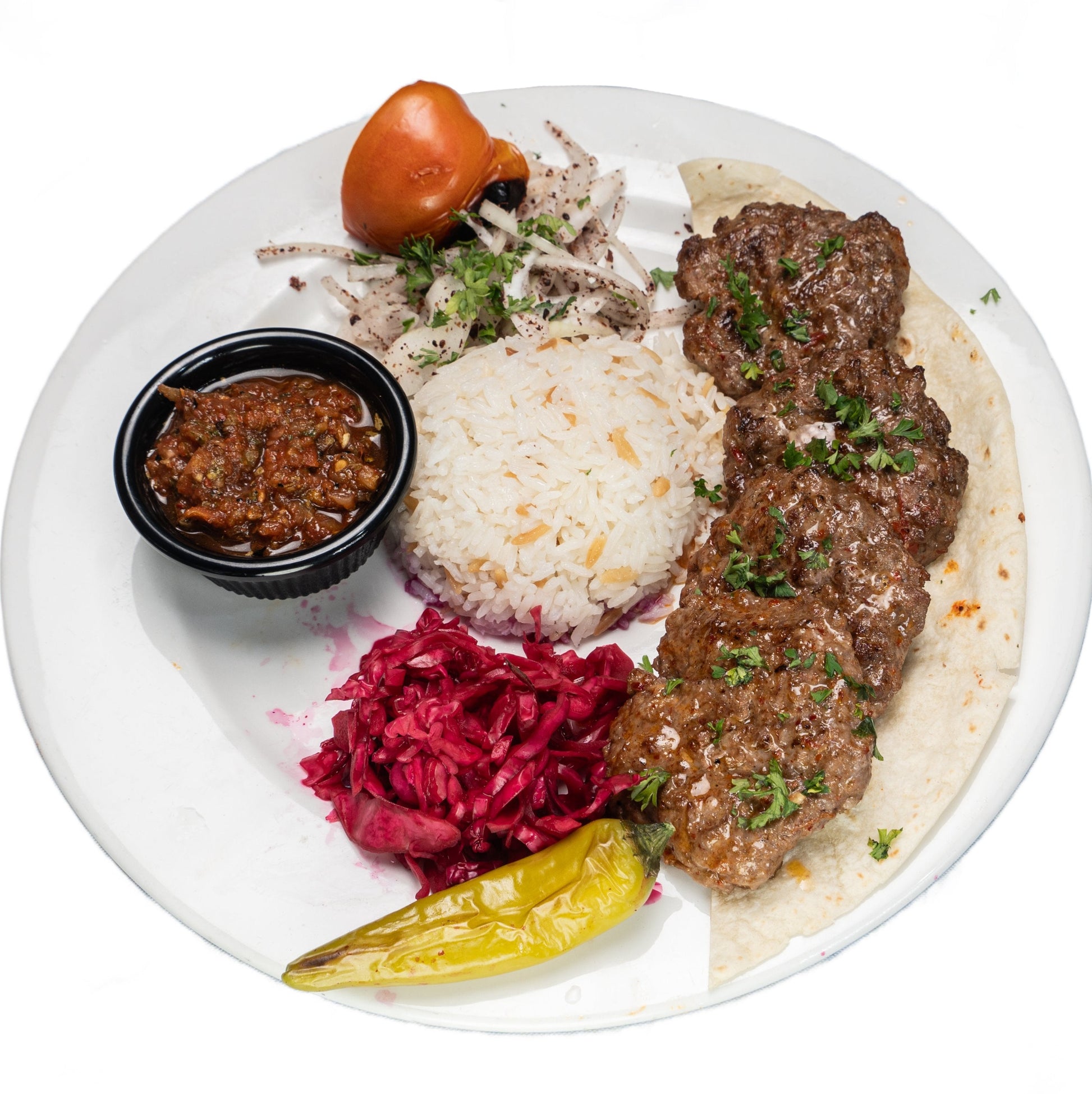 Grilled Izgara Kofte Chicken served with rice, fresh salad, and traditional Turkish spices at Zuzu Kebab Singapore